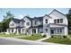 Charming new construction townhomes with Hardie board siding, black windows, and professionally landscaped yards at 6579 Parterre N Pkwy # 2, Thornton, CO 80602