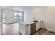 Kitchen includes new stainless appliances, hardwood floors, and quartz countertops at 6579 Parterre N Pkwy # 2, Thornton, CO 80602