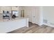 Modern kitchen featuring stainless steel appliances, granite counters, and sleek white cabinetry at 6579 Parterre N Pkwy # 2, Thornton, CO 80602
