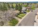 Neighborhood view showcasing the tree-lined street and well-kept lawns of this residential area at 6832 S Birch Way, Centennial, CO 80122