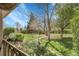 Spacious backyard showcasing lush lawn, mature trees, and a serene outdoor space at 6832 S Birch Way, Centennial, CO 80122