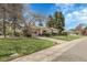 Inviting home with an attached garage, beautiful front yard and mature landscaping at 6832 S Birch Way, Centennial, CO 80122