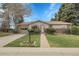 Charming single-story home featuring a well-manicured lawn and inviting brick accents at 6832 S Birch Way, Centennial, CO 80122
