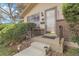 A cozy front porch highlights the entrance with a glass door and brick accents at 6832 S Birch Way, Centennial, CO 80122