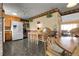 Eat-in kitchen area showcasing a breakfast nook, stone tile flooring, and ample counter space at 6832 S Birch Way, Centennial, CO 80122