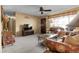 Comfortable living room features neutral colors, carpet, and a view to the outdoors at 6832 S Birch Way, Centennial, CO 80122