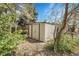 Outdoor shed with double doors in a backyard setting, offering secure storage at 6832 S Birch Way, Centennial, CO 80122