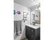 Clean bathroom with modern fixtures and storage at 19573 E Linvale Dr, Aurora, CO 80013