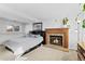 Cozy bedroom featuring a fireplace and ample space at 19573 E Linvale Dr, Aurora, CO 80013