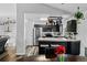 Open kitchen with dark cabinets and a pot rack at 19573 E Linvale Dr, Aurora, CO 80013