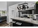 Modern kitchen with stainless steel appliances and white backsplash at 19573 E Linvale Dr, Aurora, CO 80013