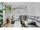 Sun-drenched living room with sectional sofa and hardwood floors at 19573 E Linvale Dr, Aurora, CO 80013