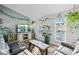 Cozy living room with lots of plants and a large TV at 19573 E Linvale Dr, Aurora, CO 80013