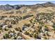 Beautiful aerial view of the neighborhood nestled near the mountains and mature trees in scenic Colorado at 4 Prairie Falcon Ln, Littleton, CO 80127