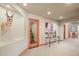 Finished basement featuring an archway, a decorative table and artwork in the hallway at 4 Prairie Falcon Ln, Littleton, CO 80127