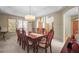 Formal dining room with a large table, elegant lighting, and abundant natural light at 4 Prairie Falcon Ln, Littleton, CO 80127