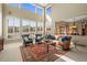 Bright living room with high ceilings, large windows, and beautiful views at 4 Prairie Falcon Ln, Littleton, CO 80127