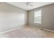 Bedroom with carpet, ceiling fan and a window with natural light at 4016 S Rome St, Aurora, CO 80018