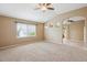 Spacious bedroom featuring vaulted ceilings, ceiling fan, and ample natural light at 4016 S Rome St, Aurora, CO 80018