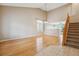 Inviting living room with high ceilings, hardwood floors, and large windows at 4016 S Rome St, Aurora, CO 80018
