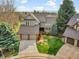 Aerial view of a beautiful home showcasing mature trees, landscaping, and a well-manicured lawn at 6505 S Garfield Ct, Centennial, CO 80121