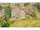 Aerial view featuring a home with lush landscaping, a well-maintained lawn, and a charming covered porch at 6505 S Garfield Ct, Centennial, CO 80121