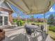 Covered back deck perfect for outdoor dining and relaxation overlooking manicured lawn at 6505 S Garfield Ct, Centennial, CO 80121