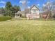 Expansive backyard featuring a charming two-story home with a manicured lawn at 6505 S Garfield Ct, Centennial, CO 80121