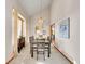 Inviting dining room with modern chandelier, neutral colors, and access to other areas of the home at 6505 S Garfield Ct, Centennial, CO 80121