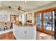 Modern kitchen island cooktop, a view of dining area, and hardwood floors, perfect for Gathering gathering at 6505 S Garfield Ct, Centennial, CO 80121