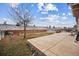 Large backyard with patio, grassy area, and wooden fence at 11590 River Oaks Ln, Commerce City, CO 80640