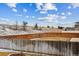 Fenced backyard with a view of the surrounding landscape at 11590 River Oaks Ln, Commerce City, CO 80640