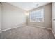 Spacious bedroom with neutral walls and carpet flooring at 11590 River Oaks Ln, Commerce City, CO 80640
