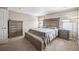 Bright bedroom with a king-size bed and plenty of closet space at 11590 River Oaks Ln, Commerce City, CO 80640