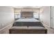 Spacious bedroom with large bed, nightstands, and ample natural light at 11590 River Oaks Ln, Commerce City, CO 80640