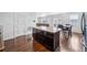 Open kitchen with island and views into adjacent living areas at 11590 River Oaks Ln, Commerce City, CO 80640