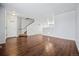 Spacious living area with hardwood floors and a staircase at 11590 River Oaks Ln, Commerce City, CO 80640