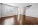 Bright living room with hardwood floors and neutral walls at 11590 River Oaks Ln, Commerce City, CO 80640