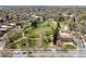 An aerial shot of a scenic neighborhood park enveloped by lush green trees and walking paths at 2944 Hooker St, Denver, CO 80211