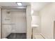 Modern bathroom with a glass-enclosed shower, pedestal sink, and stylish fixtures at 2944 Hooker St, Denver, CO 80211