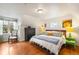 Bright bedroom with hardwood floors and comfortable furnishings at 2944 Hooker St, Denver, CO 80211