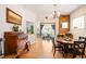 Charming dining area adjacent to the living room, featuring hardwood floors at 2944 Hooker St, Denver, CO 80211