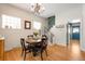 Cozy dining room with natural light, hardwood floors and access to the staircase at 2944 Hooker St, Denver, CO 80211