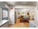 Charming kitchen and dining area with decorative ceiling and hardwood floors at 2944 Hooker St, Denver, CO 80211