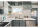 Kitchen with quartz countertops, a stainless steel dishwasher, and ample cabinet space at 2944 Hooker St, Denver, CO 80211