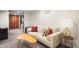 Cozy living room featuring a plush sofa, stylish accent pillows, and a unique coffee table at 2944 Hooker St, Denver, CO 80211