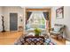Inviting living room with hardwood floors, large windows, and comfortable seating at 2944 Hooker St, Denver, CO 80211
