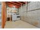 Functional basement space with laundry appliances and storage shelving at 999 N Emerson St # 10, Denver, CO 80218