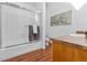Functional bathroom featuring a shower-tub combo with sliding glass doors and updated fixtures, offering practical comfort at 999 N Emerson St # 10, Denver, CO 80218