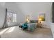 Spacious bedroom with vaulted ceilings, a large window, and a comfortable bed dressed with stylish linens at 999 N Emerson St # 10, Denver, CO 80218